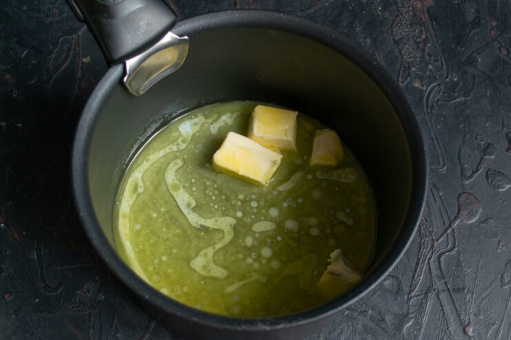 Preparing the butter Cubed butter melting in a saucepan on the stove