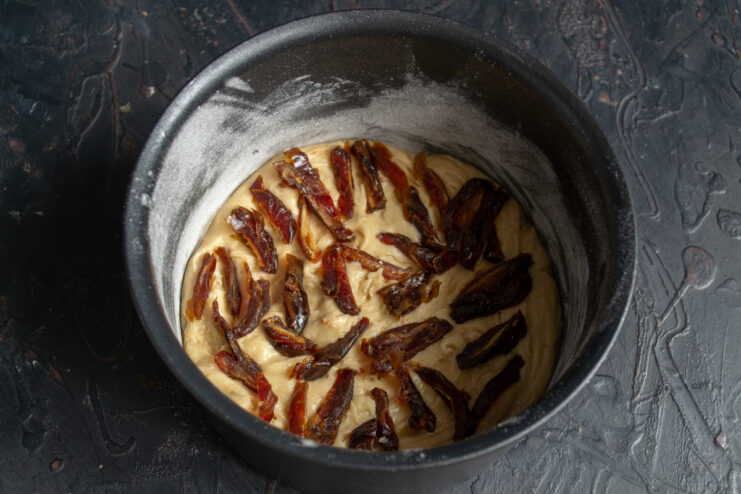 Date filling Sliced dates layered over cake batter in a pan