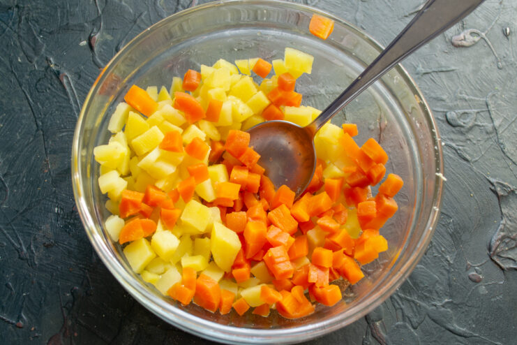 Vegetable base Diced potatoes and carrots in a large salad bowl