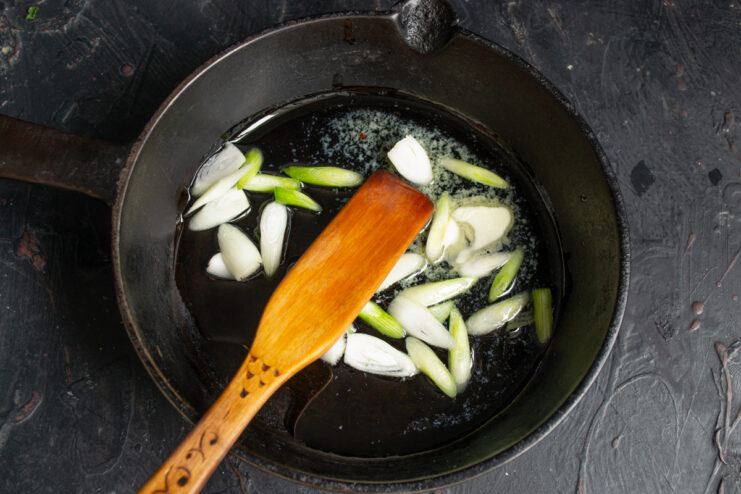 Sautéing onions for the sauce Diced onions sautéing in a skillet with butter and oil