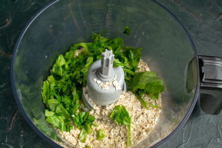 Adding spinach to the batter Chopped fresh spinach in a blender with oats