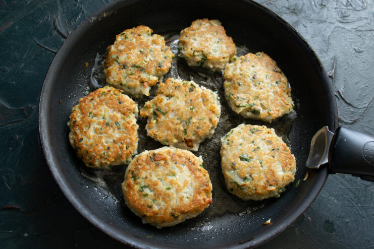 Golden Brown Patties Flipped golden brown oat patties cooking in a skillet