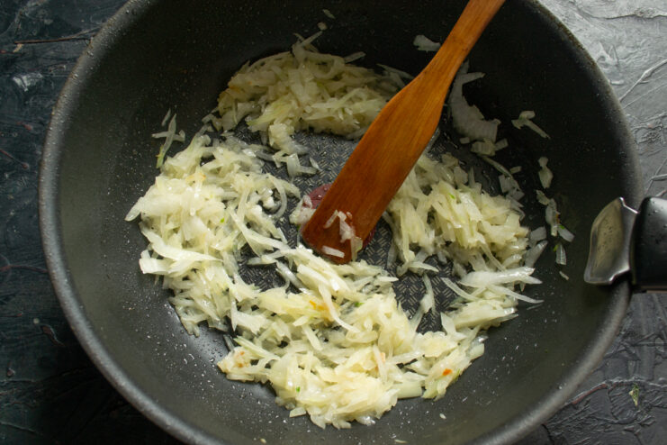 Sautéing the Vegetables Sautéed onion and garlic in a skillet