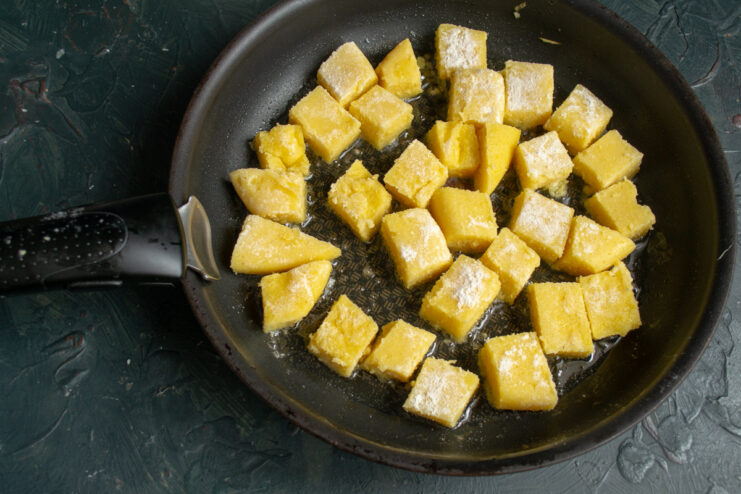 Frying The Polenta Frying polenta cubes in a skillet