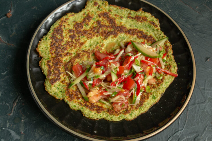 Assembling the oat crepe Vegetable filling placed on half of the oat crepe