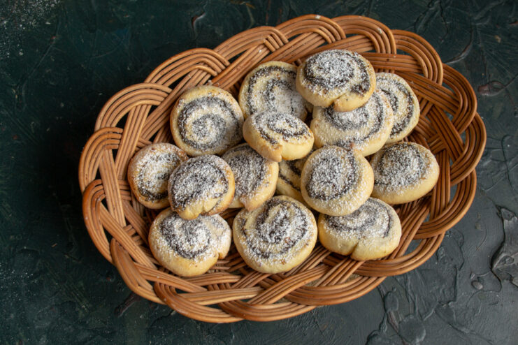 Serving the Cookies Poppy seed and dried fruit cookies in a basket on a fabric background