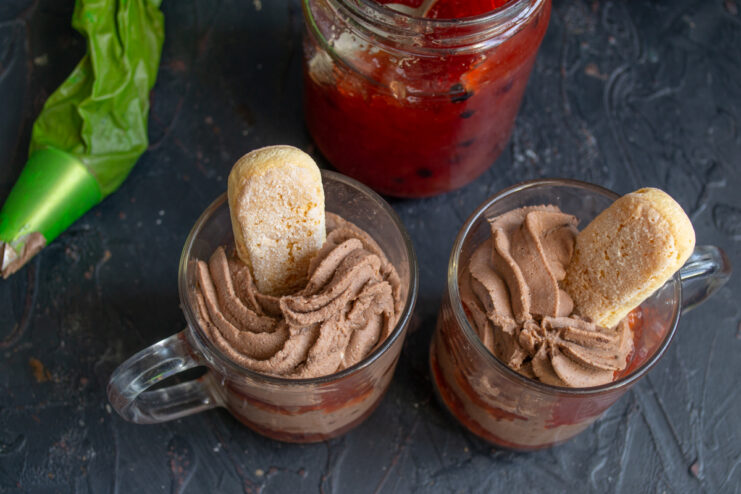 A Savoiardi ladyfinger biscuit inserted into the chocolate dessert.