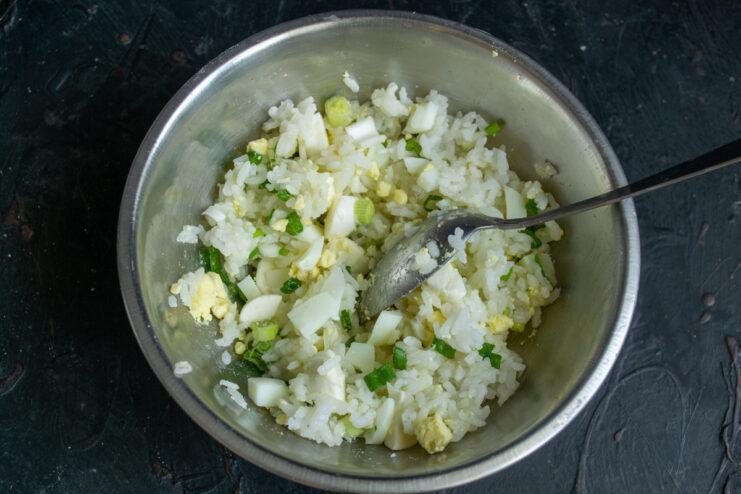 Fully mixed filling of rice, eggs, scallions, and cheese