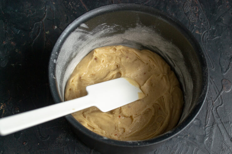 Spreading batter in the pan First layer of batter spread evenly in a baking pan
