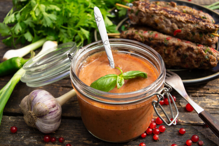 Vibrant savory redcurrant sauce enhancing the flavor of meat dishes like kebabs