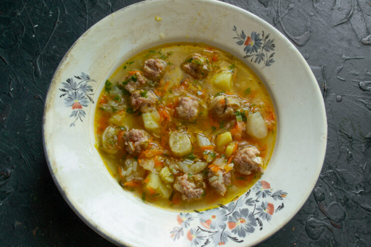Serving the dish Portion of Jerusalem artichoke soup in a deep serving bowl