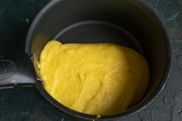 Cooking The Polenta Cooking polenta porridge in a pot