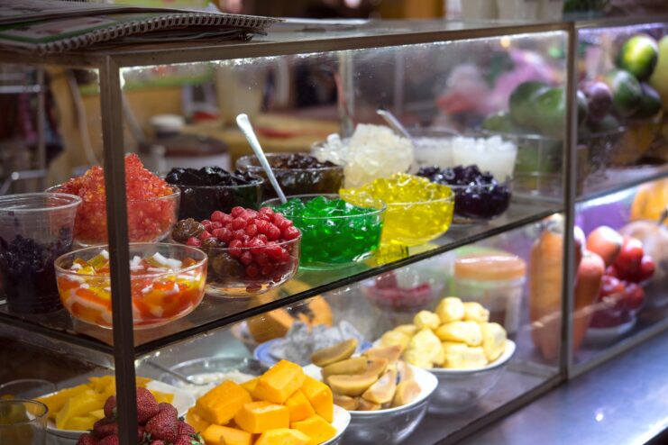 Colorful ingredients for Vietnamese che dessert Display counter showing various colorful ingredients and jellies for Vietnamese che dessert.