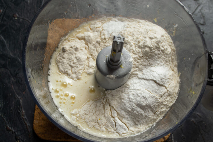 Adding dry ingredients Wheat flour and baking powder in the blender bowl