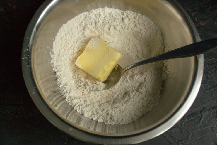 Dough ingredients All-purpose flour and butter gathered in a mixing bowl