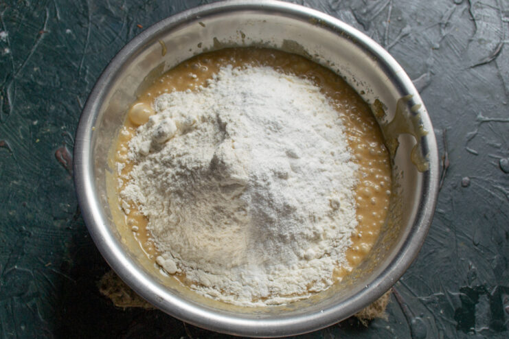 All-purpose flour added on top of the wet ingredient mixture