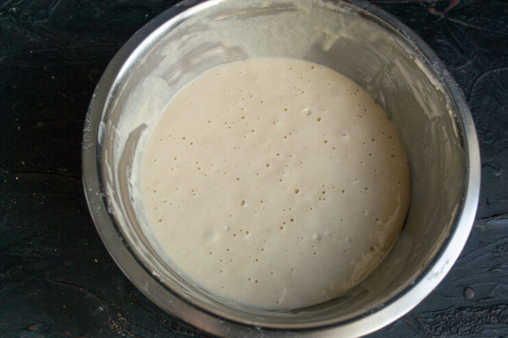 Ready bubbly batter Bubbly and fluffy sourdough batter before frying