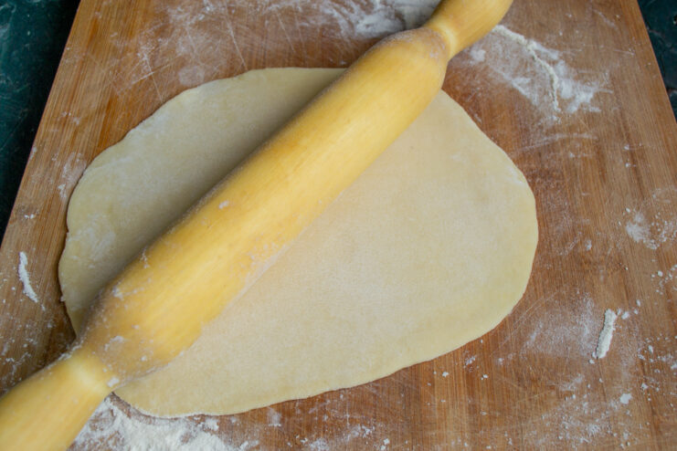 Rolling out the dough Rolling out a thin sheet of shortcrust pastry with a rolling pin