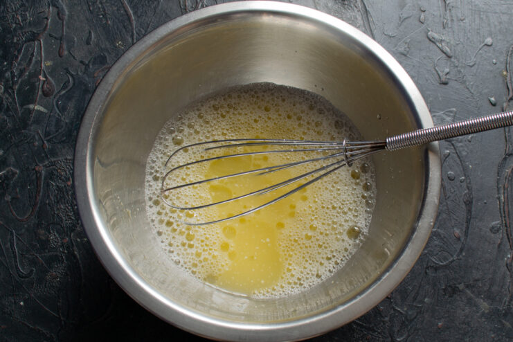 Vegetable oil poured into the bowl with wet ingredients