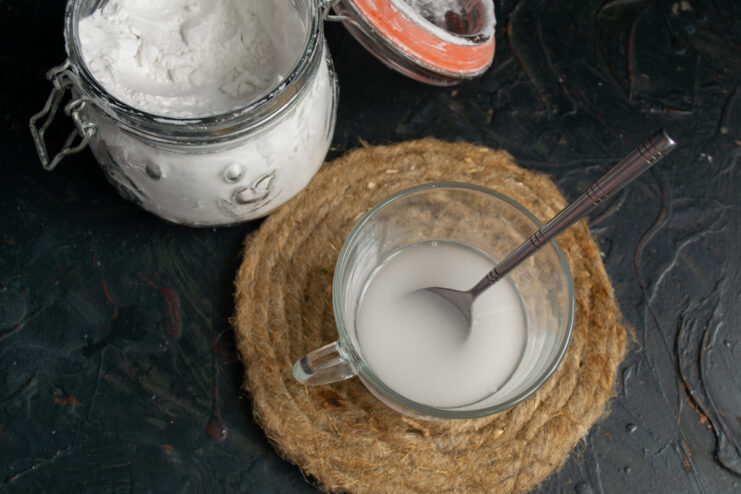 Dissolving potato starch in a small amount of cold water to create a thickening slurry