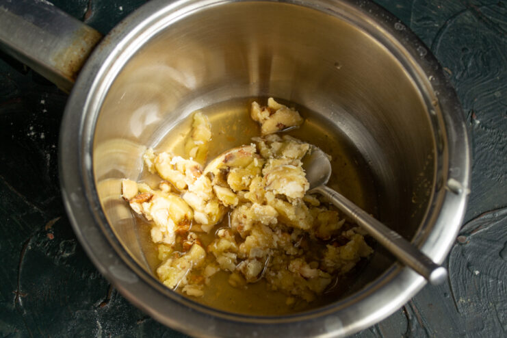 Honey Syrup Ingredients Chopped nuts and honey in a saucepan for syrup