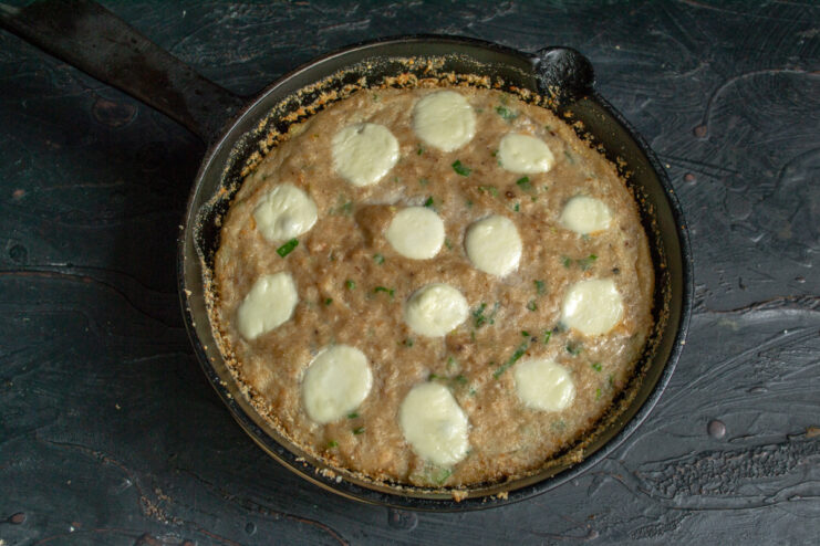Baking to perfection Freshly baked fish casserole in a cast-iron skillet.
