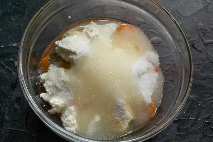 Adding sugar and oil Granulated sugar and olive oil added to the mixing bowl