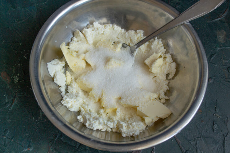 Granulated sugar poured into the dough mixture