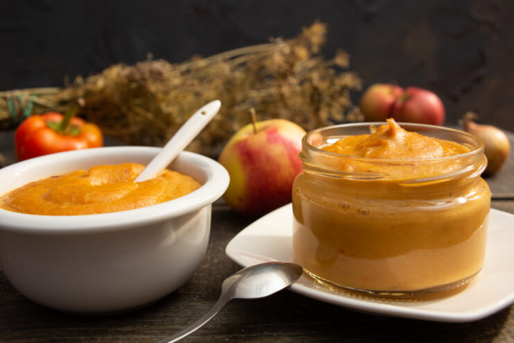 Oven-roasted vegetable pate spread on toast with apples and bell peppers