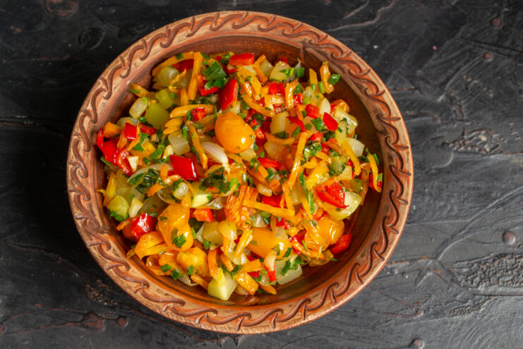 Zucchini ratatouille served in an elegant ceramic plate.