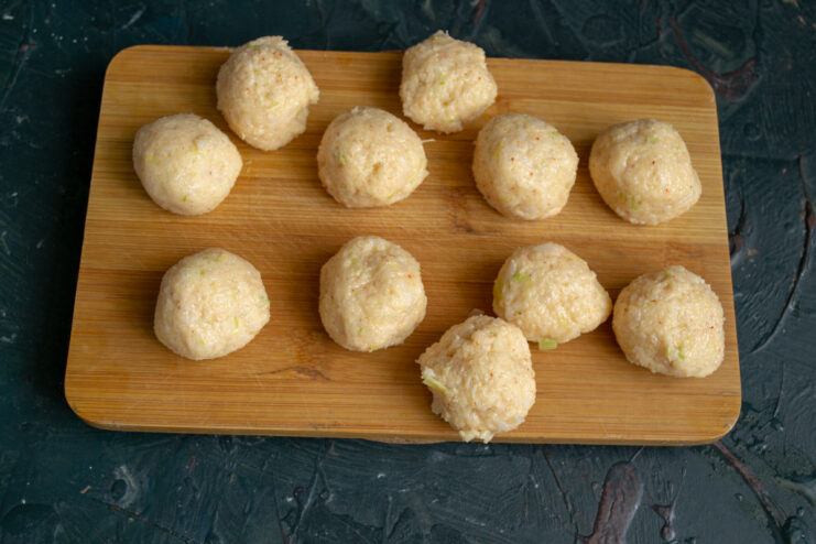 Shaping round dumplings with damp hands