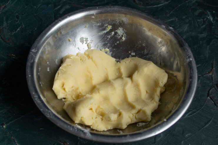 Kneading The Dough A ball of smooth shortbread dough resting in a mixing bowl