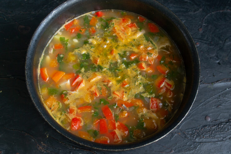 Final Simmer Simmering nettle and pepper soup in a pot on the stove