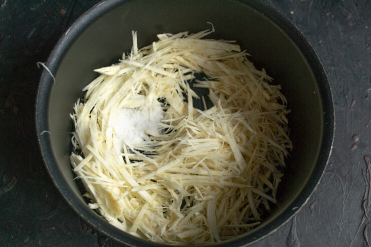 Julienning the celeriac Thinly julienned celeriac strips ready for blanching