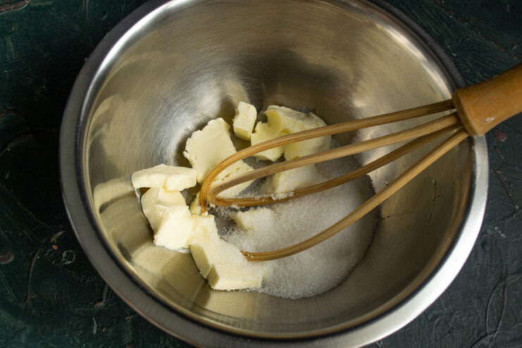 Creaming Butter And Sugar Butter and sugar in a mixing bowl with a whisk