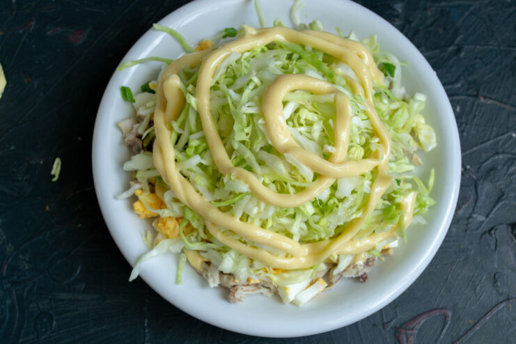 Cabbage layer with sauce Layer of cabbage topped with mayonnaise in Anthill salad