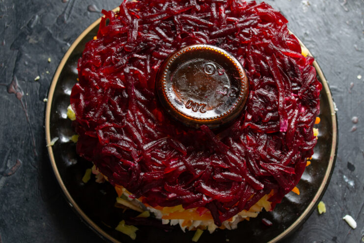 Beet layer Vibrant layer of grated beets covering the Shuba salad