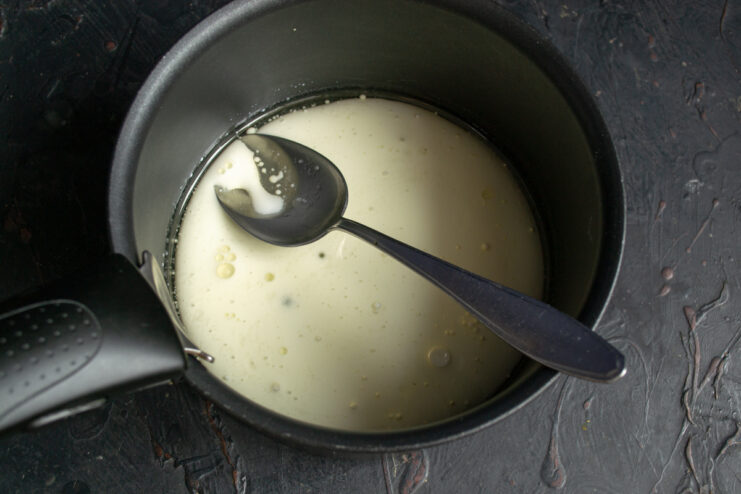 Preparing the liquid base for the dough Milk and oil mixture heating in a heavy-bottomed saucepan