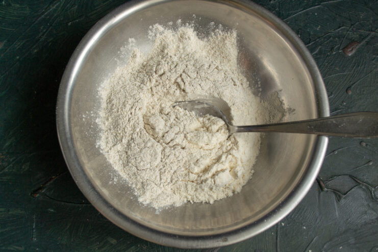 Preparing the Flour Base Mixing rye and whole wheat flour in a bowl