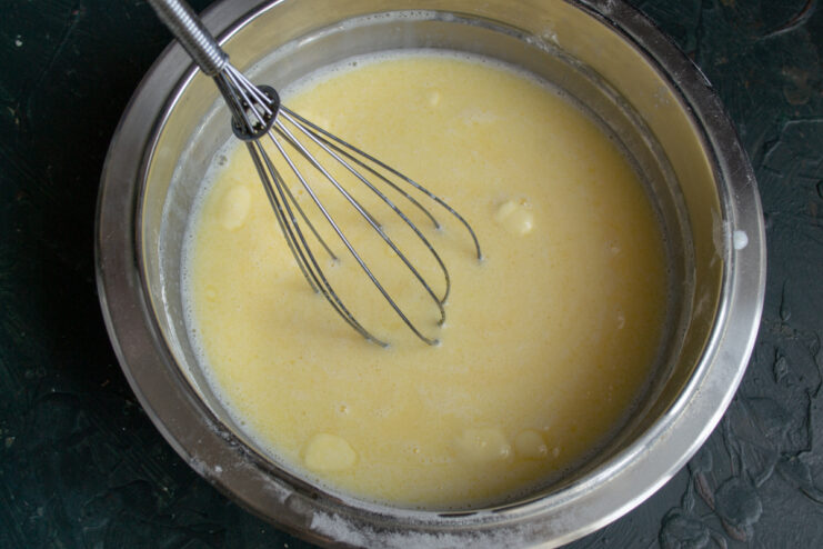 Combining Wet Ingredients Mixing wet ingredients with a whisk in a bowl