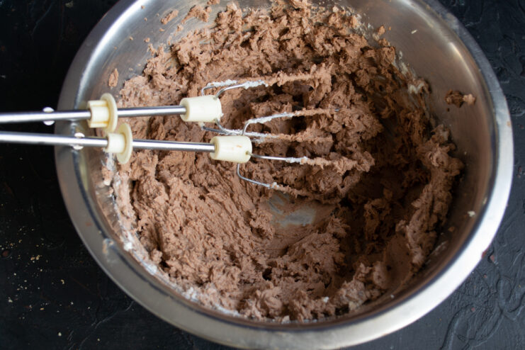 Folding the chocolate ganache into the whipped ricotta cream.
