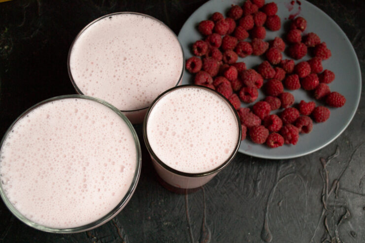 Ready for Chilling Glasses of layered raspberry and milk jelly ready to be chilled