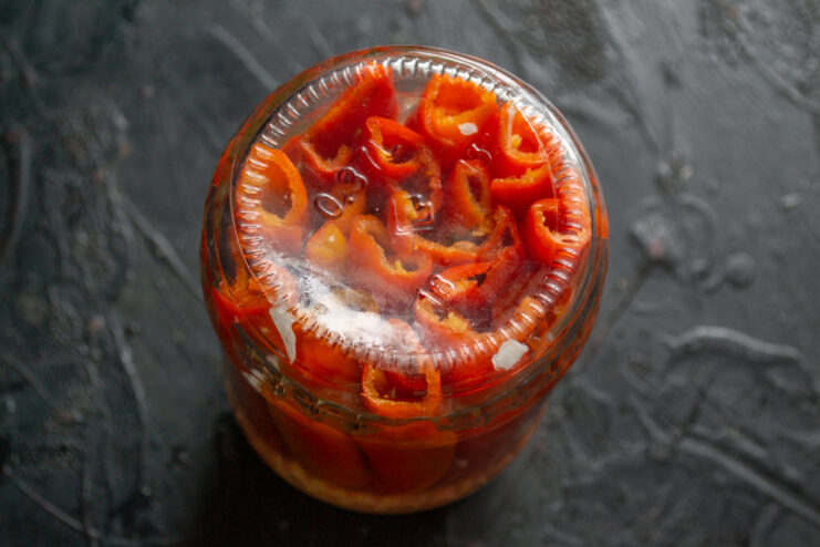 Cooling the jar Inverted sterilized jar of chili peppers cooling upside down