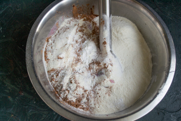 Adding The Dry Ingredients Dry ingredients including flour cocoa powder and baking powder in a bowl