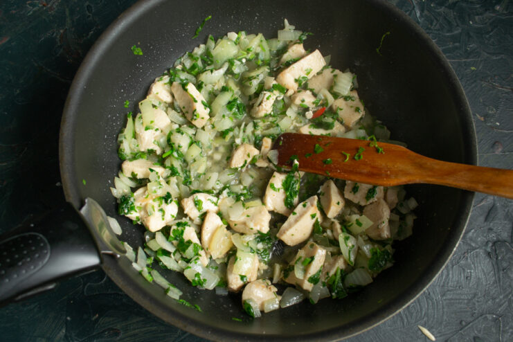 Freshly chopped cilantro added to the chicken and onion mixture