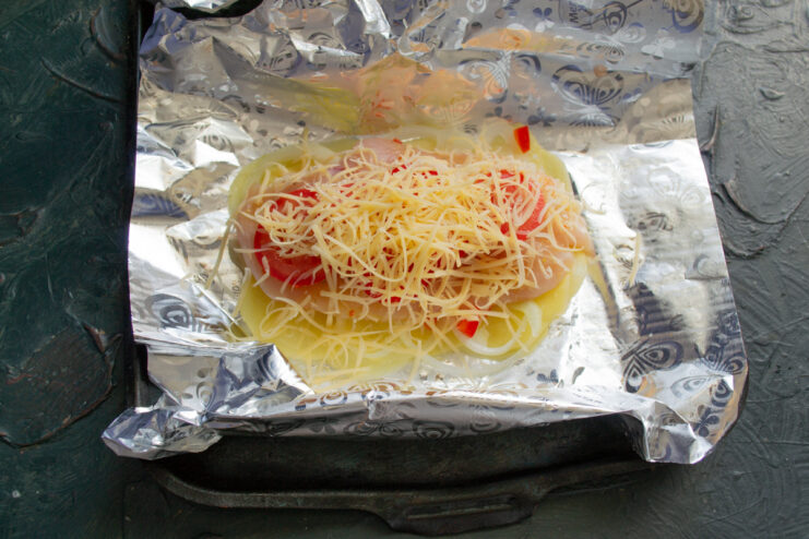 Cheese layer Grated hard cheese sprinkled on top of tomatoes