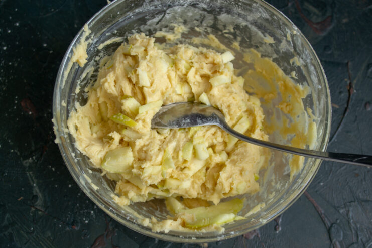 Cookie dough evenly mixed with fresh chopped apple chunks