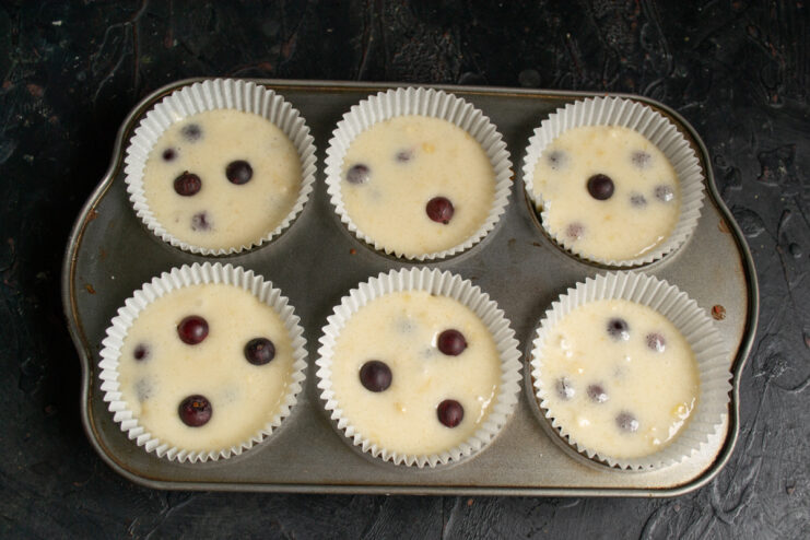 Gooseberry muffin batter portioned into paper liners