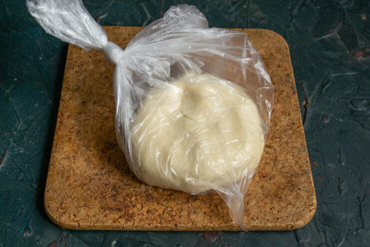 Dough resting inside a clear plastic bag