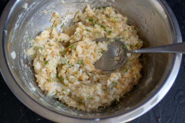 Ready Meatball Mixture Well-mixed ground chicken, rice, and dill resting in a metal bowl.